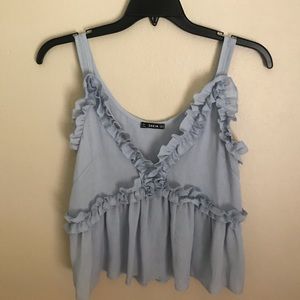 Blue frilly blouse